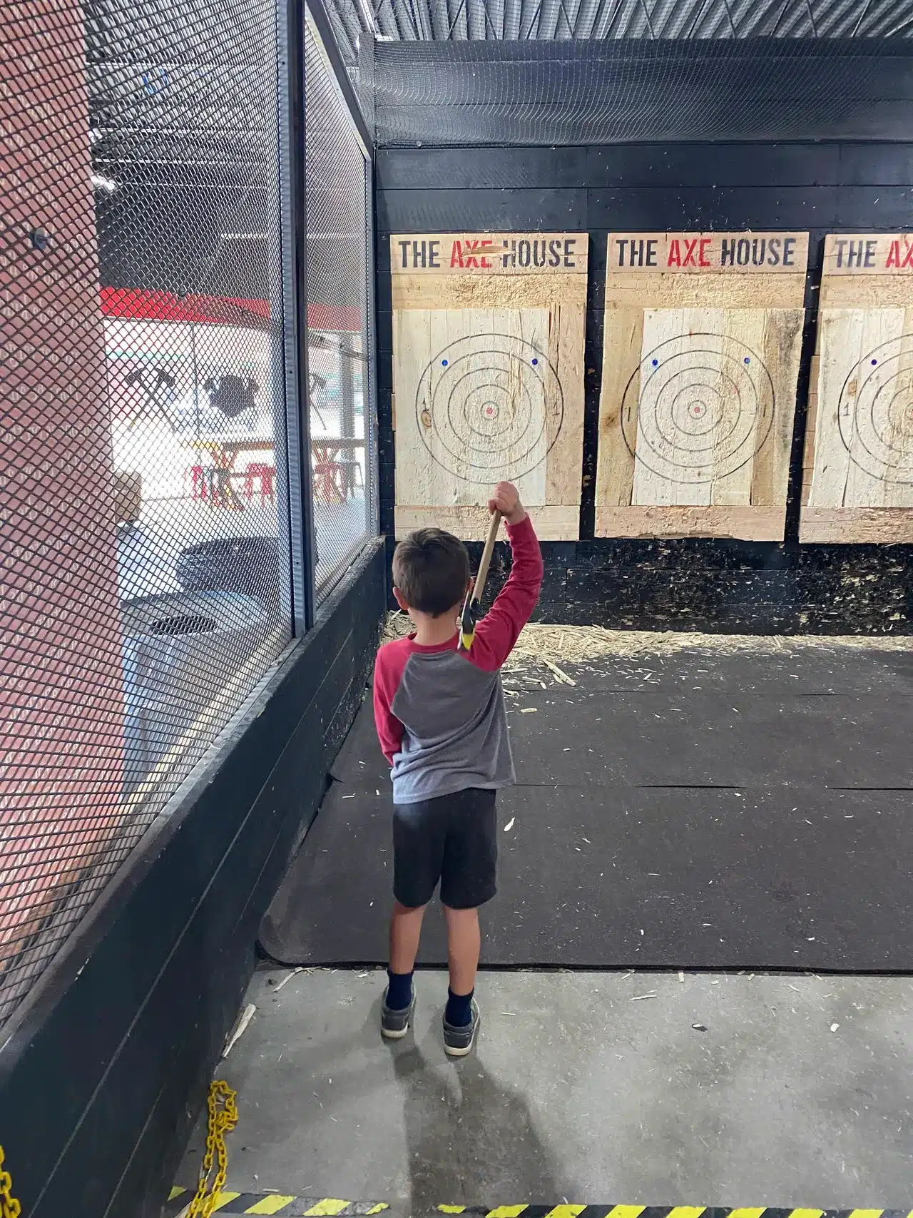 Child throwing an axe