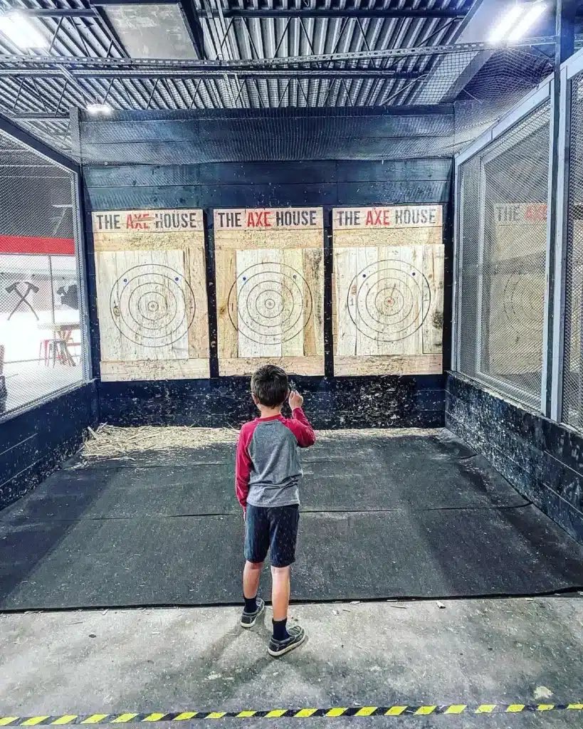 Child throwing an axe