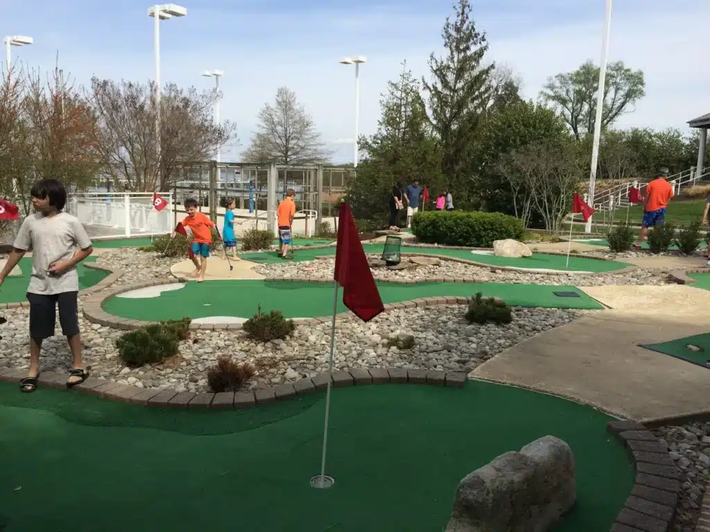 Group of people playing putt-putt