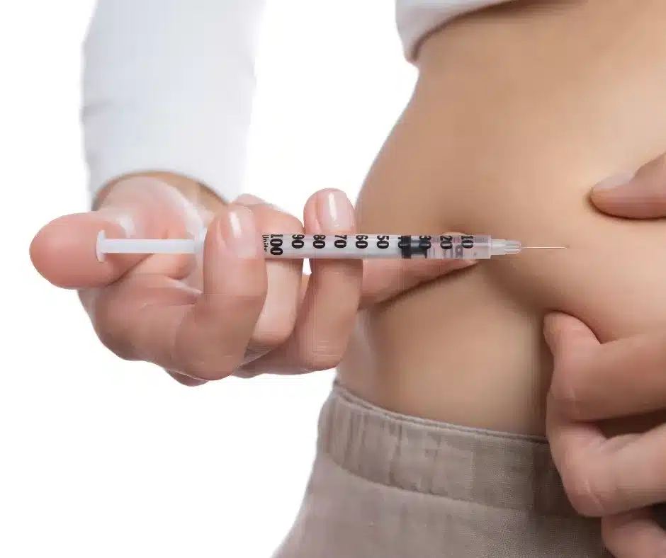 Woman injecting herself with medication