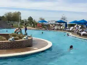 People playing in and around a pool