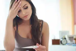 Woman looking at pregnancy test