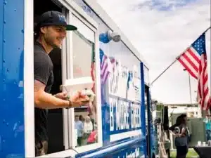 Man serving food from food truck