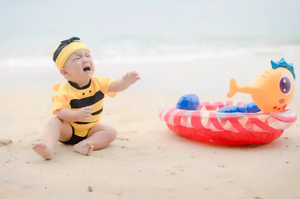 Crying baby at the beach