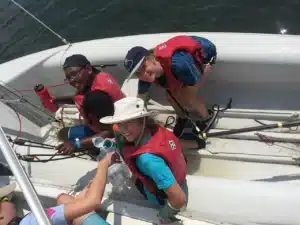 Four people on a sailboat