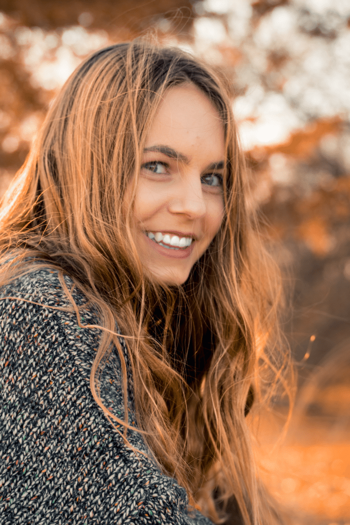 Smiling woman in the fall