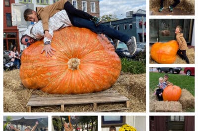 Dad and son laying on giant pumpkin