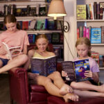 3 girls reading books