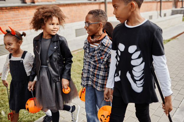 kids walking and trick or treating