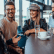 two couples talking at a coffee shop