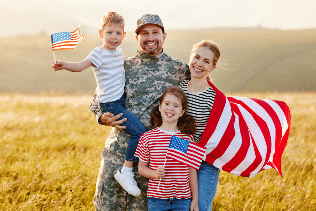 Veteran and family with American flags