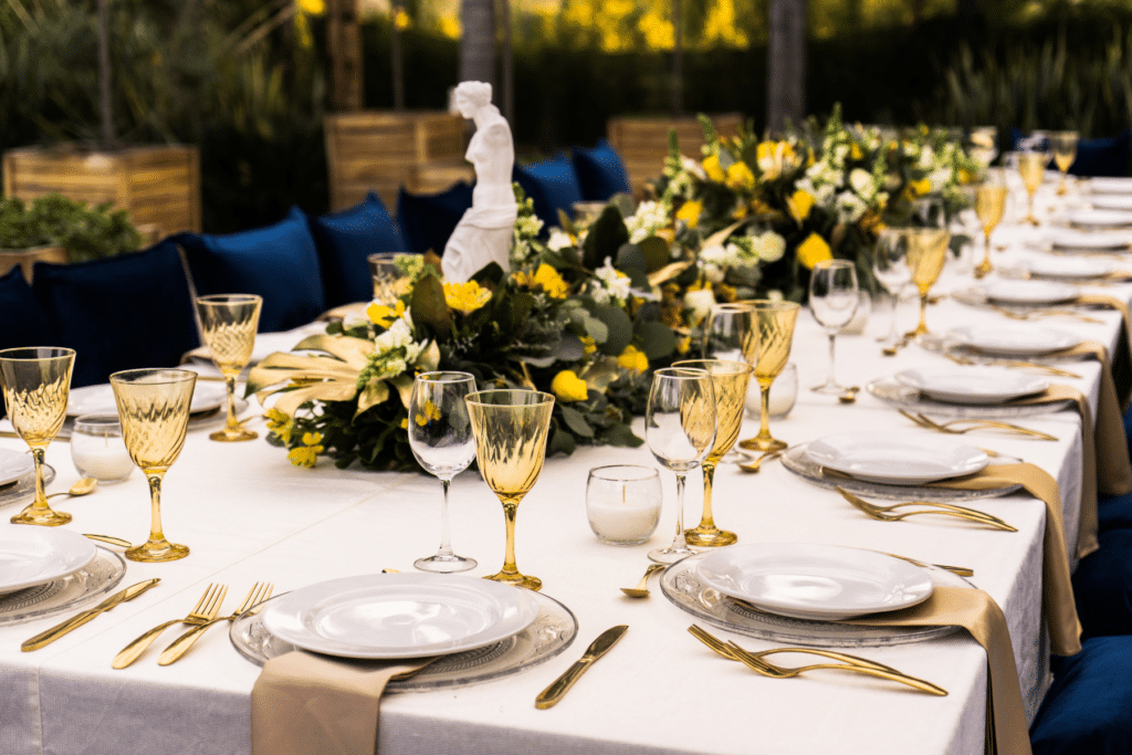 Beautifully set formal dining with white, gold and yellow