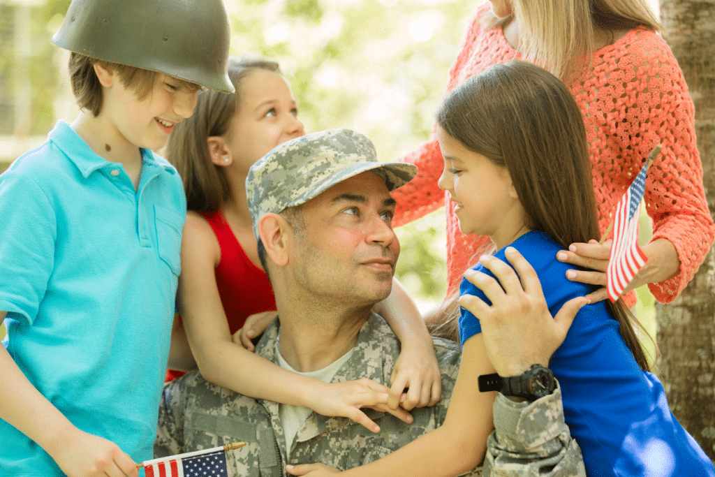 Family greeting veteran dad