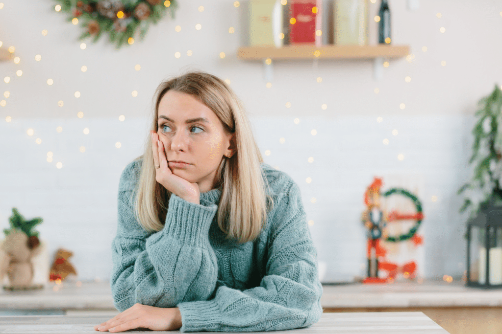 A woman looking depressed during the Christmas holiday