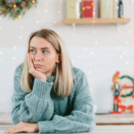 A woman looking depressed during the Christmas holiday