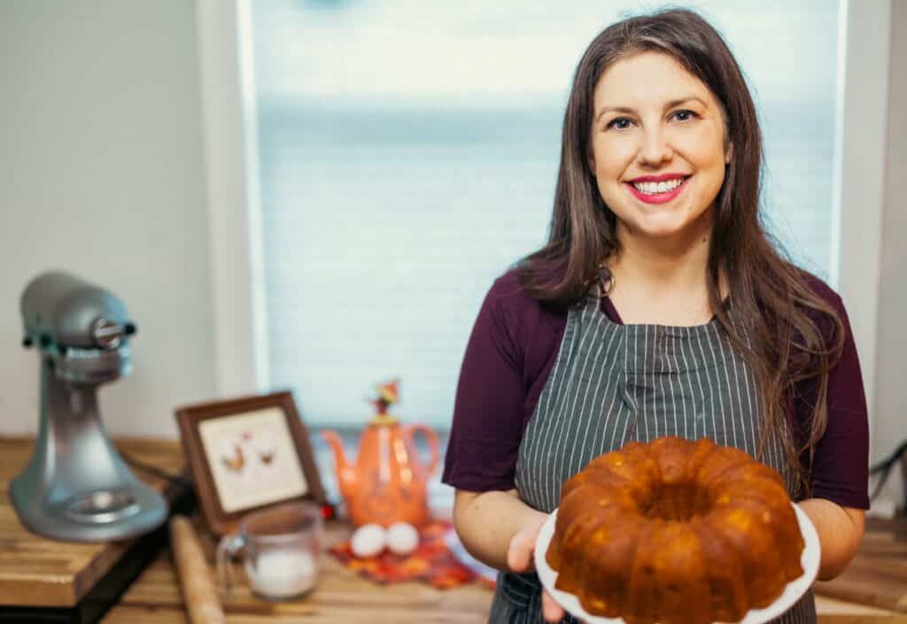 woman holding up her bundt cake