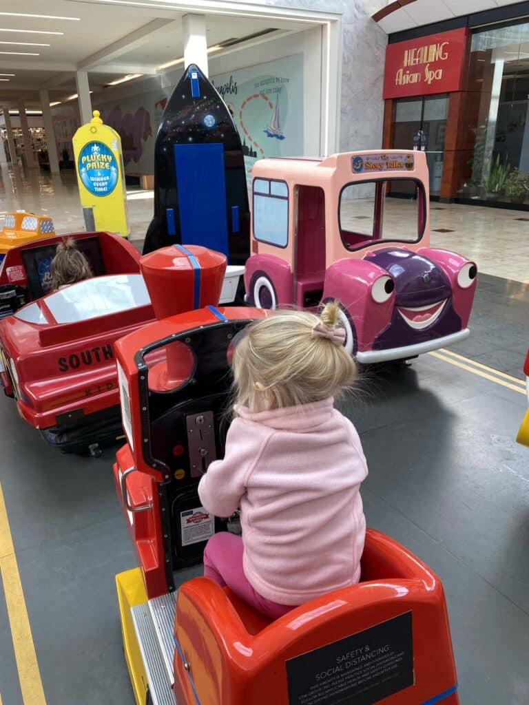 kid playing at mall