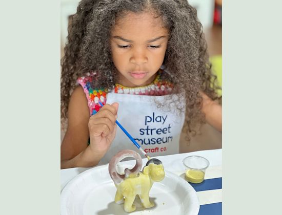 Child Painting a monkey statue