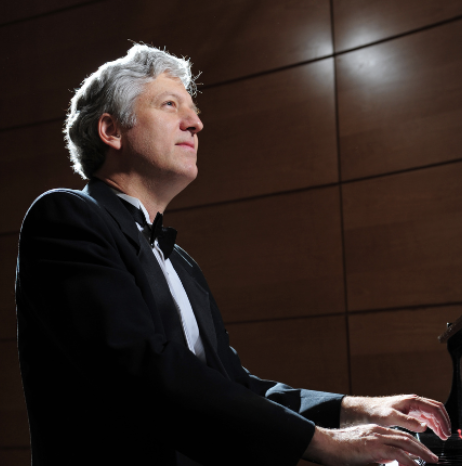 Man in tuxedo playing piano