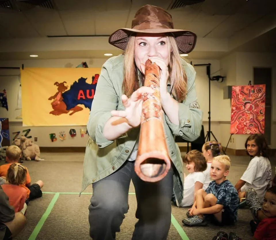 Woman playing a digeridoo