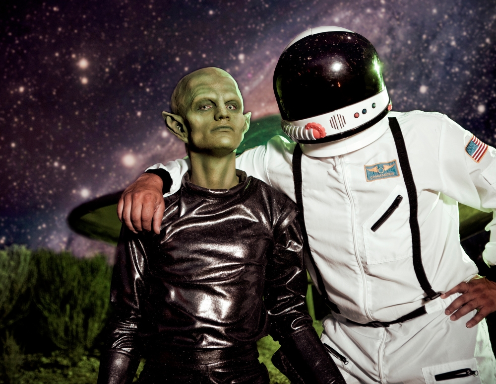 An alien and an astronaut posing together for the Alien Adventure Escape Room