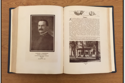 A photo of a book open to a soldier with a description on one side, and a photo of a gazebo with another description on the other side, associated with the Anchors Aweigh Music Tour.