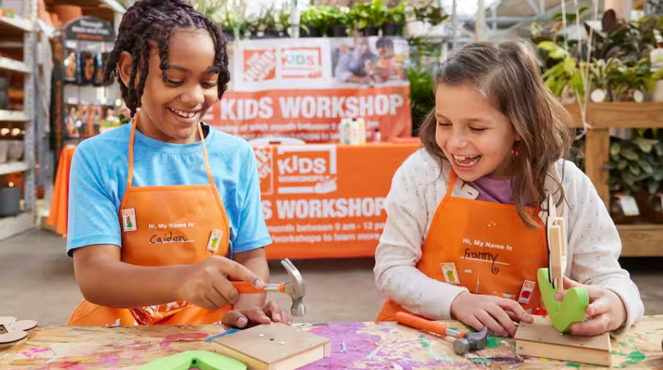 two girls creating crafts at Home depot