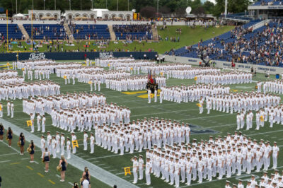 Naval Academy Midshipmen lined up on football field