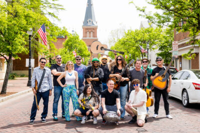 Group of musicians posed in the middle of the street
