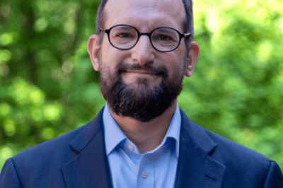 man in a suit with glasses