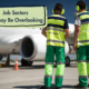 2 men workers by an airplane